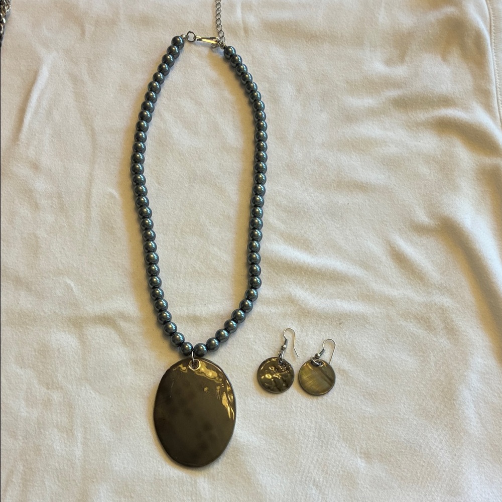 Dark grey necklace and earring.